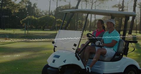 Couple Enjoying Golf Cart Ride on Scenic Fairway
