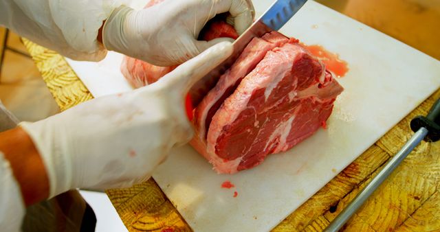 Butcher Cutting Large Steak on Wooden Cutting Board - Download Free Stock Images Pikwizard.com