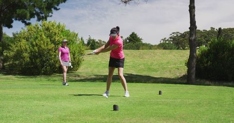 Two Women Enjoying a Day of Golf on Lush Course - Download Free Stock Images Pikwizard.com