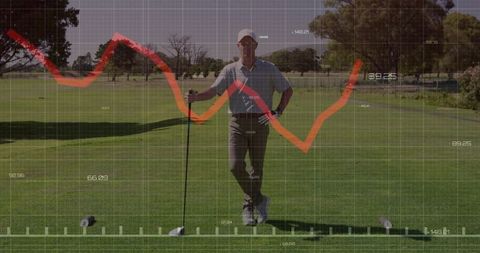 Golfer analyzing performance data on tee box
