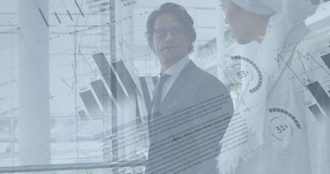 Financial Growth Charts Overlay Two Diverse Business Colleagues Discussing Strategy