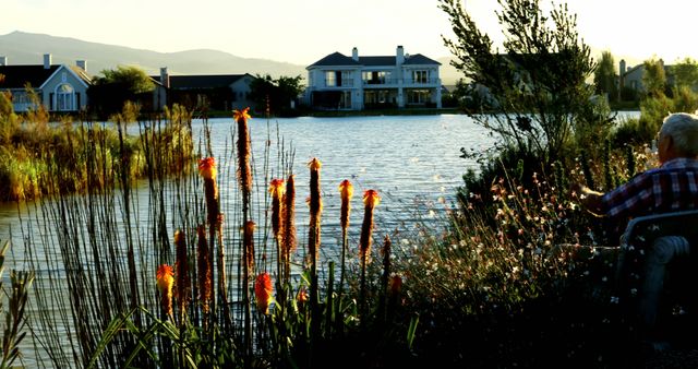 Serene Elderly Man Relaxing by Lake at Sunset - Download Free Stock Images Pikwizard.com