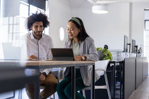 Collaborative Teamwork at Modern Office with Digital Devices