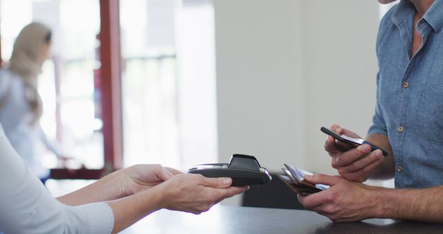 Customer Making Contactless Payment With Smartphone at Checkout Counter - Download Free Stock Images Pikwizard.com