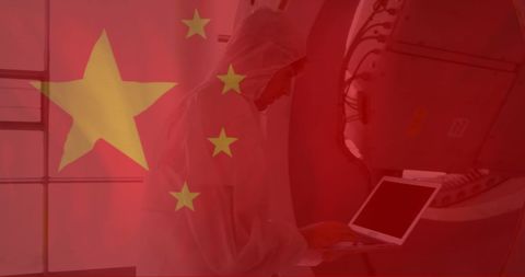 Scientist Engaged in Research Laptop Overlaid by Chinese Flag