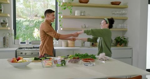Couple Bonding in Modern Kitchen with Fresh Vegetables