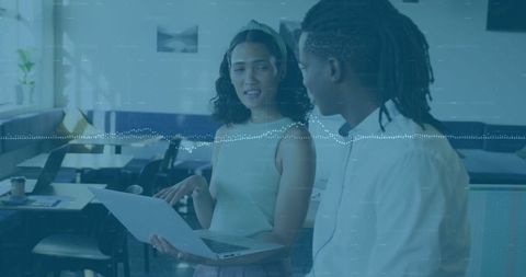 Business Colleagues Discussing Project in Modern Office With Laptop