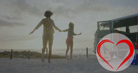 Diverse Couple Running on Beach with Love Symbol