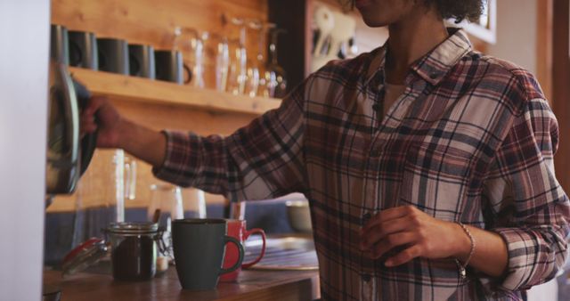 Woman Pouring Hot Beverage in Cozy Cafe - Download Free Stock Images Pikwizard.com