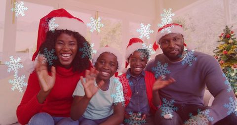 Smiling Family Celebrating Christmas with Santa Hats