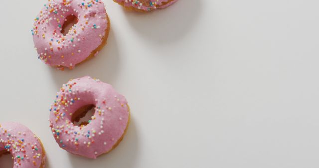 Pink Frosted Donuts with Sprinkles on White Background - Download Free Stock Images Pikwizard.com