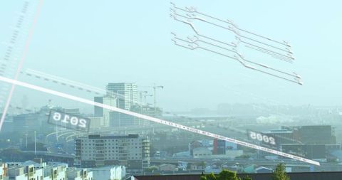 Mid-rise skyline rising with construction cranes over curved highway and digital overlays