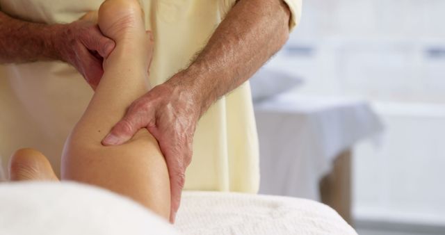 Masseur Working on Client's Calf in Spa - Download Free Stock Images Pikwizard.com