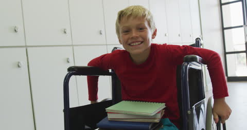 Smiling Boy in Wheelchair at School Indicating Inclusivity