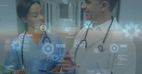 Medical Team Reviewing Digital Clinical Data in Hospital Corridor with Futuristic HUD