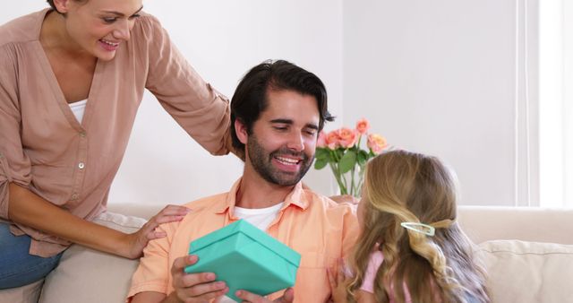 Father Receiving Gift from Daughter on Father’s Day Celebration at Home - Download Free Stock Images Pikwizard.com