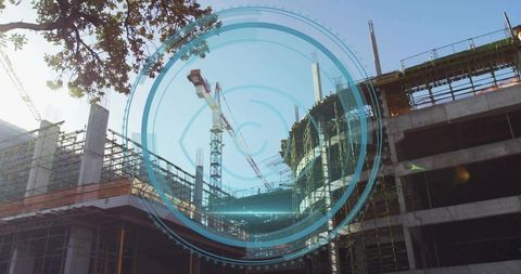 Modern Construction Site with Holographic Overlay on High-Rise Building