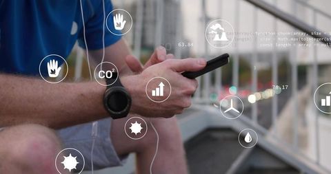 Adult male using smartphone with wearable data overlays on urban overpass at dusk