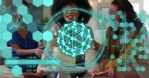 Woman manipulating teal holographic network interface in collaborative tech workspace