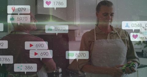 Couple cooking with social media notifications overlaying modern kitchen