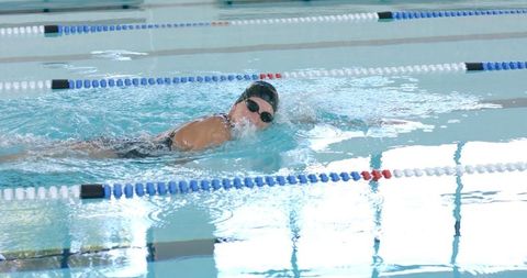Female Swimmer Practicing Freestyle Stroke in Indoor Pool - Download Free Stock Images Pikwizard.com