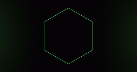 Green neon hexagon on dark background