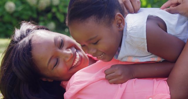 Mother and daughter smiling and bonding in park - Download Free Stock Images Pikwizard.com