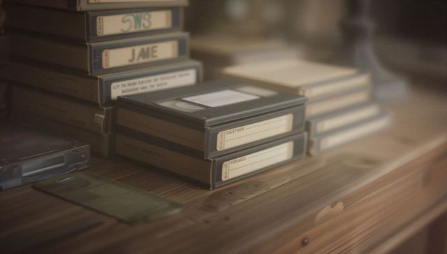 Vintage Videocassette Collection Display on Wooden Dresser