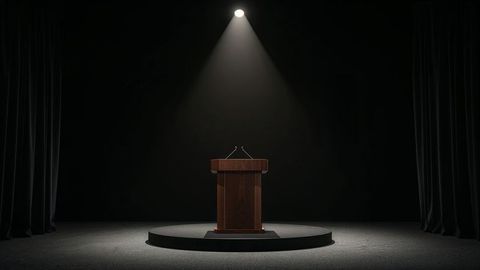 Press release spotlight on wooden lectern with microphones on stage