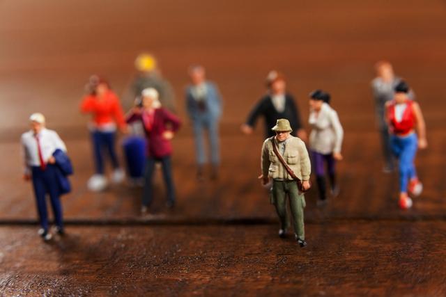 Conceptual image of miniature people travelling