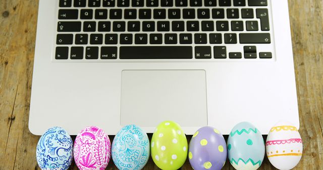 Easter eggs before a laptop merge tradition with technology for modern celebrations. - Download Free Stock Photos Pikwizard.com