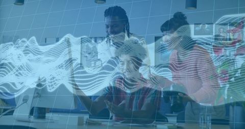 Team analyzing data together using modern technology in office