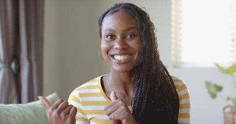Smiling Woman in Striped Shirt Introducing Online Project - Download Free Stock Images Pikwizard.com