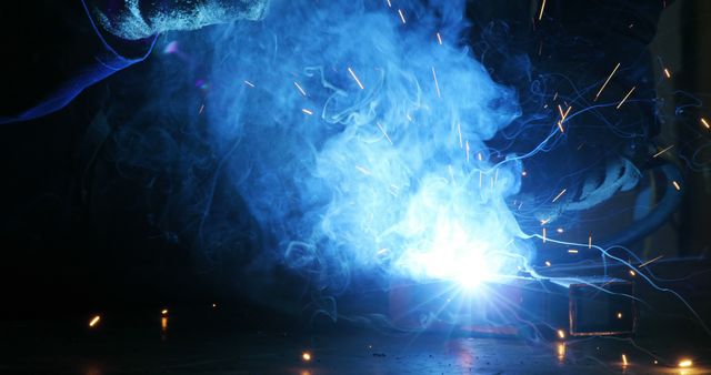 Close-Up of Welder Working with Blue Flames and Sparks - Download Free Stock Images Pikwizard.com