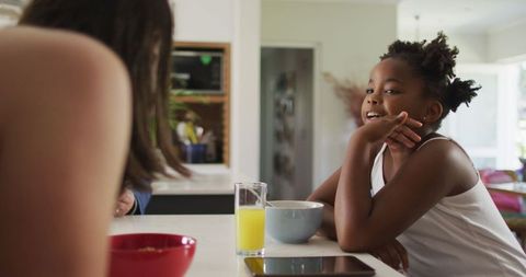 Happy Family Breakfast with Diverse Mother and Daughter