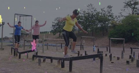 Women Practicing Balance On Outdoor Fitness Course