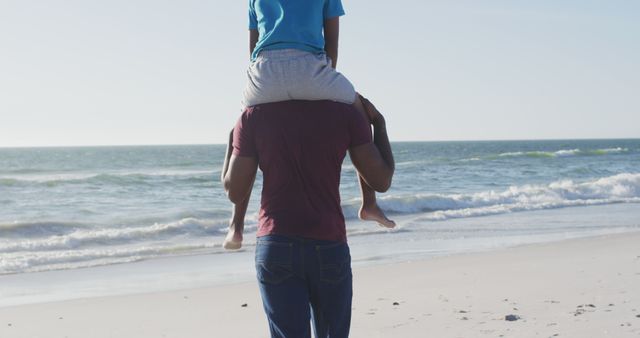 Father Carrying Child on Shoulders by the Beach - Download Free Stock Images Pikwizard.com