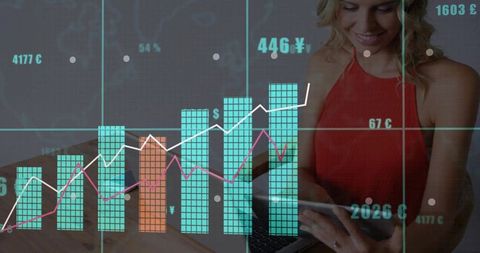 Woman tapping tablet with laptop, overlaid financial charts and fintech analytics dashboard