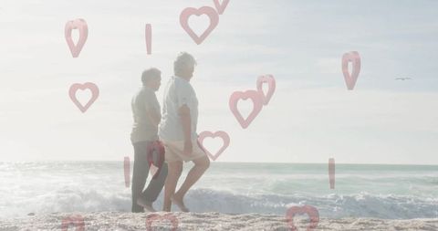 Senior Couple Enjoying Leisure Walk on Beach with Love Overlay