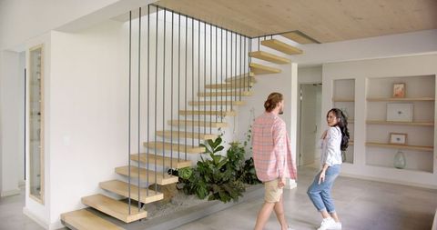 Modern open concept home with unique floating staircase