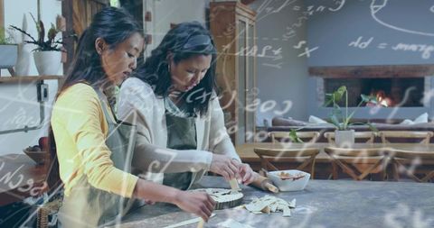 Baking lattice fruit tart together in cozy kitchen, women preparing pastry and showcasing teamwork
