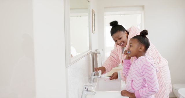 African American Mother and Daughter Brushing Teeth in Bathroom - Download Free Stock Images Pikwizard.com