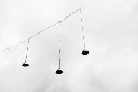 minimalist outdoor hanging lamps against cloudy sky - Download Free Stock Images Pikwizard.com