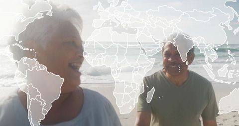 Smiling Senior Couple Walking on Beach with World Map Overlay