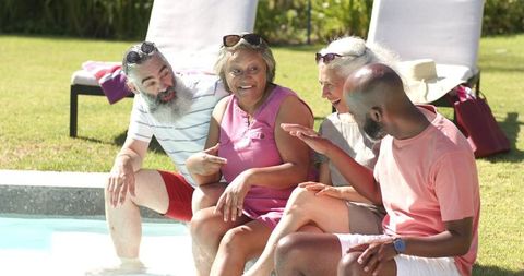 Senior Friends Relaxing By Pool Exchanging Stories - Download Free Stock Images Pikwizard.com