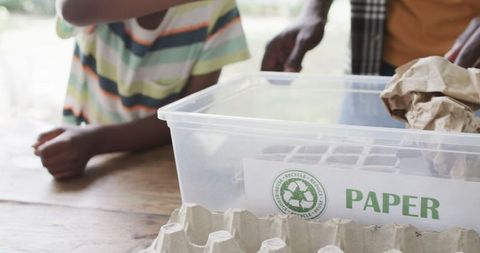 Child recycling educational experience at home