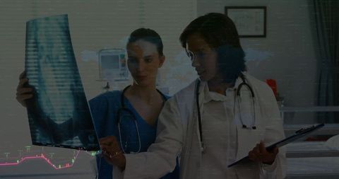Medical Professionals Analyzing X-ray in Hospital Care Setting