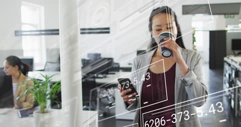 Businesswoman Analyzing Digital Data While Drinking Coffee