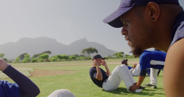 Baseball Team Doing Sit-Ups During Outdoor Training - Download Free Stock Images Pikwizard.com