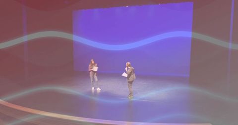 Actors rehearsing their lines on theater stage